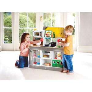 Kids can play together at this spacious kitchen playset, designed for small‑group fun. It includes a rechargeable fan stove with air effect, light, and sound, plus a microwave, coffee maker, fridge, oven, garage sorter, two interactive stovetops, extra counter space, storage, and accessories such as a menu, pan, spatula, ladle, and cups. Easy to assemble.